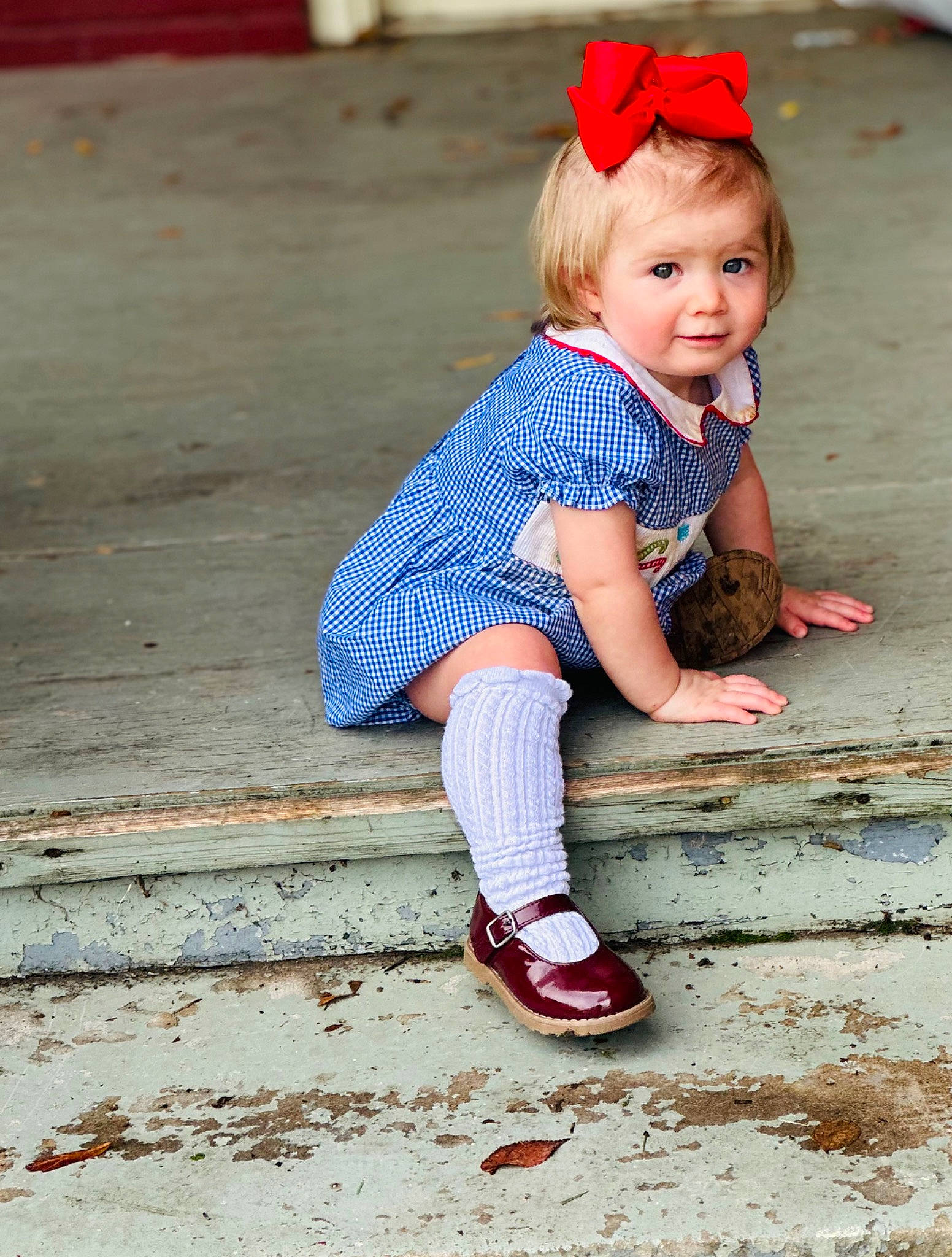 Paislee is registered to the contest to win money with this photo: baby, baby_toddler_clothing, child, electric_blue, face, fashion_accessory, flooring, foot, happy, human_leg, knee, magenta, pattern, person, pink, plaid, sitting, smile, thigh, toddler