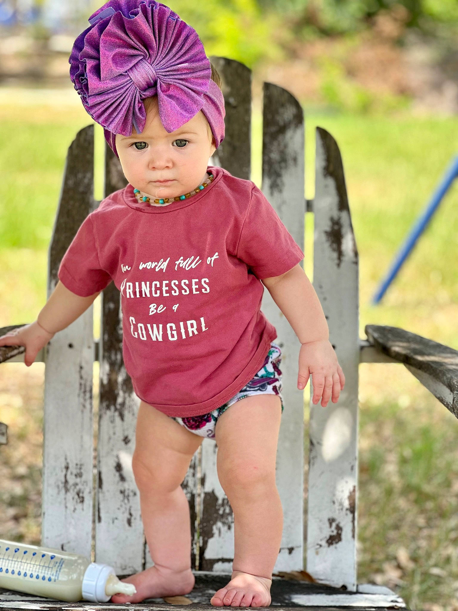 Paislee joined the competition — help win amazing prizes! beanie, cap, child, fashion_accessory, fun, grass, happy, headpiece, headwear, jewellery, landscape, leisure, magenta, people_in_nature, person, personal_protective_equipment, pink, recreation, soil, t_shirt