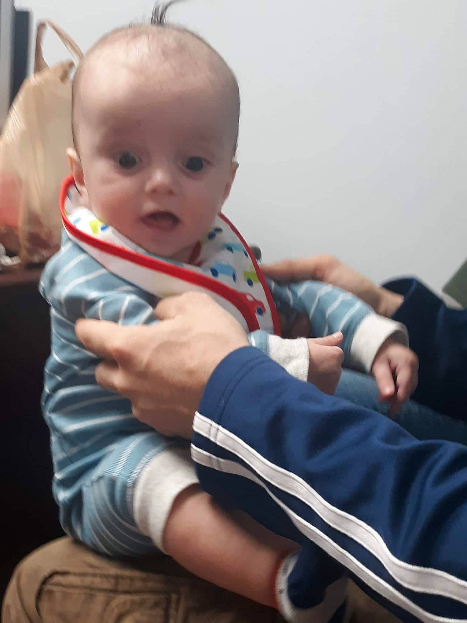 Maliki joined the competition — help win amazing prizes! arm, baby, baby_toddler_clothing, cheek, comfort, elbow, finger, gesture, hand, happy, human_body, joint, knee, neck, person, sitting, skin, sleeve, surprise, t_shirt