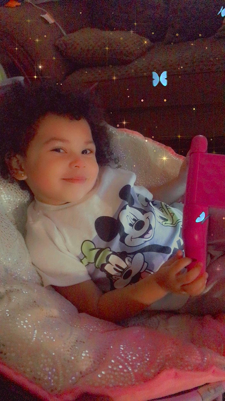 Lennon K joined the competition — help win amazing prizes! baby, cheek, child, christmas, event, finger, fun, hand, happy, holiday, human_body, joy, lap, person, pink, rose, sitting, skin, smile, stuffed_toy