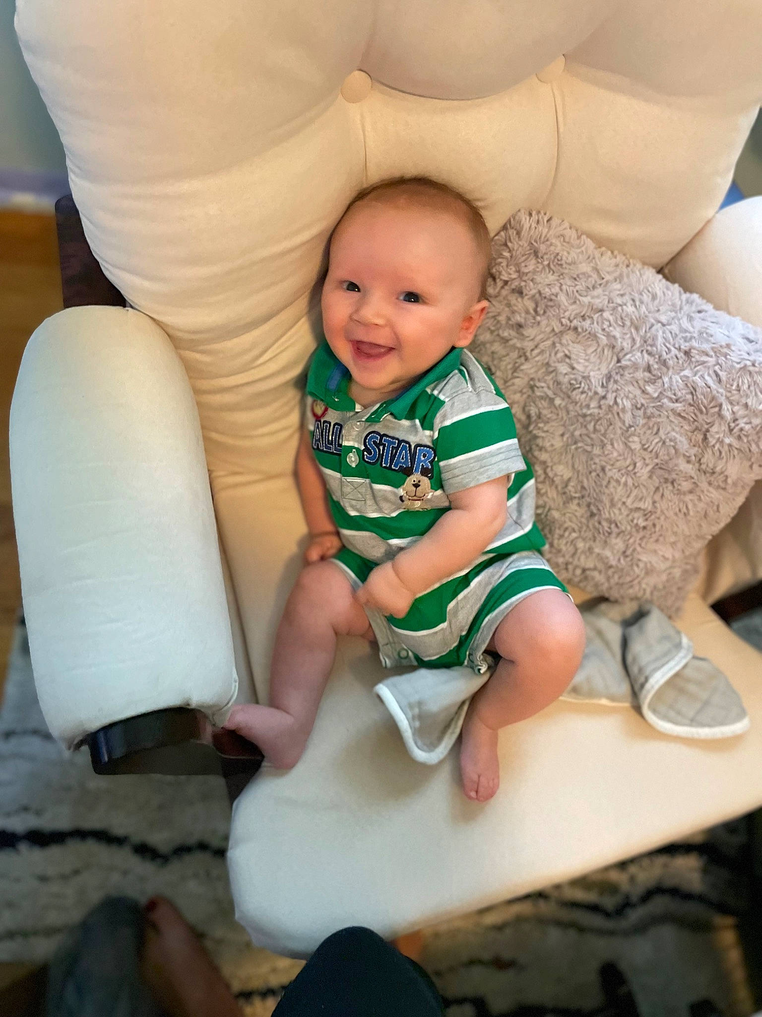 Josiah is registered to the contest to win money with this photo: baby, baby_toddler_clothing, beauty, child, comfort, couch, finger, fun, hairstyle, happy, joy, knee, lap, leg, person, product, skin, sleeve, smile, sock