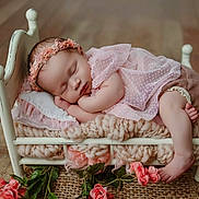 Josie joined the competition — help win amazing prizes! baby, sleeping, pink_dress, headband, small_bed, blanket, flower, wooden_floor, infant, peaceful, cute, newborn, soft_texture, decor, cozy, portrait, resting, skin, foot, hand