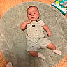 Kye joined the competition — help win amazing prizes! baby, child, infant, floor, mat, overalls, socks, baby_wipes, tile_floor, person, indoor, looking_up, cute, small, laying_down, clothing, home, carpet, feet, curious