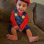 Cannon joined the competition — help win amazing prizes! toddler, child, costume, mario, red_hat, blue_overalls, smiling, sitting, barefoot, couch, indoor, cute, person, face, happy, clothing, portrait, young_child, fun, playful
