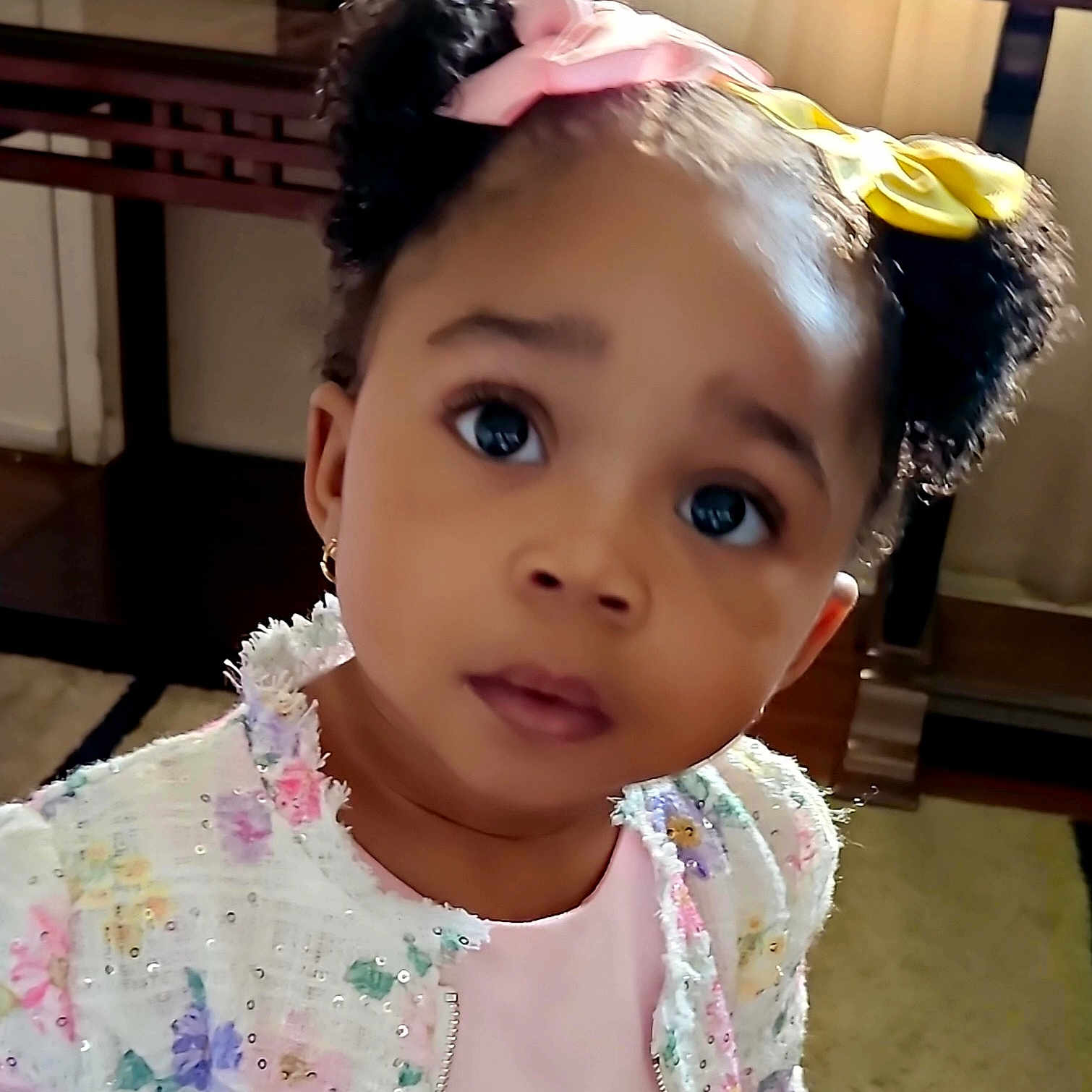 Vision joined the competition — help win amazing prizes! toddler, child, girl, curly_hair, hair_bows, indoor, jacket, pastel_colors, floral_pattern, portrait, face, big_eyes, earrings, young_child, cute, expression, person, clothing, head, warm_lighting