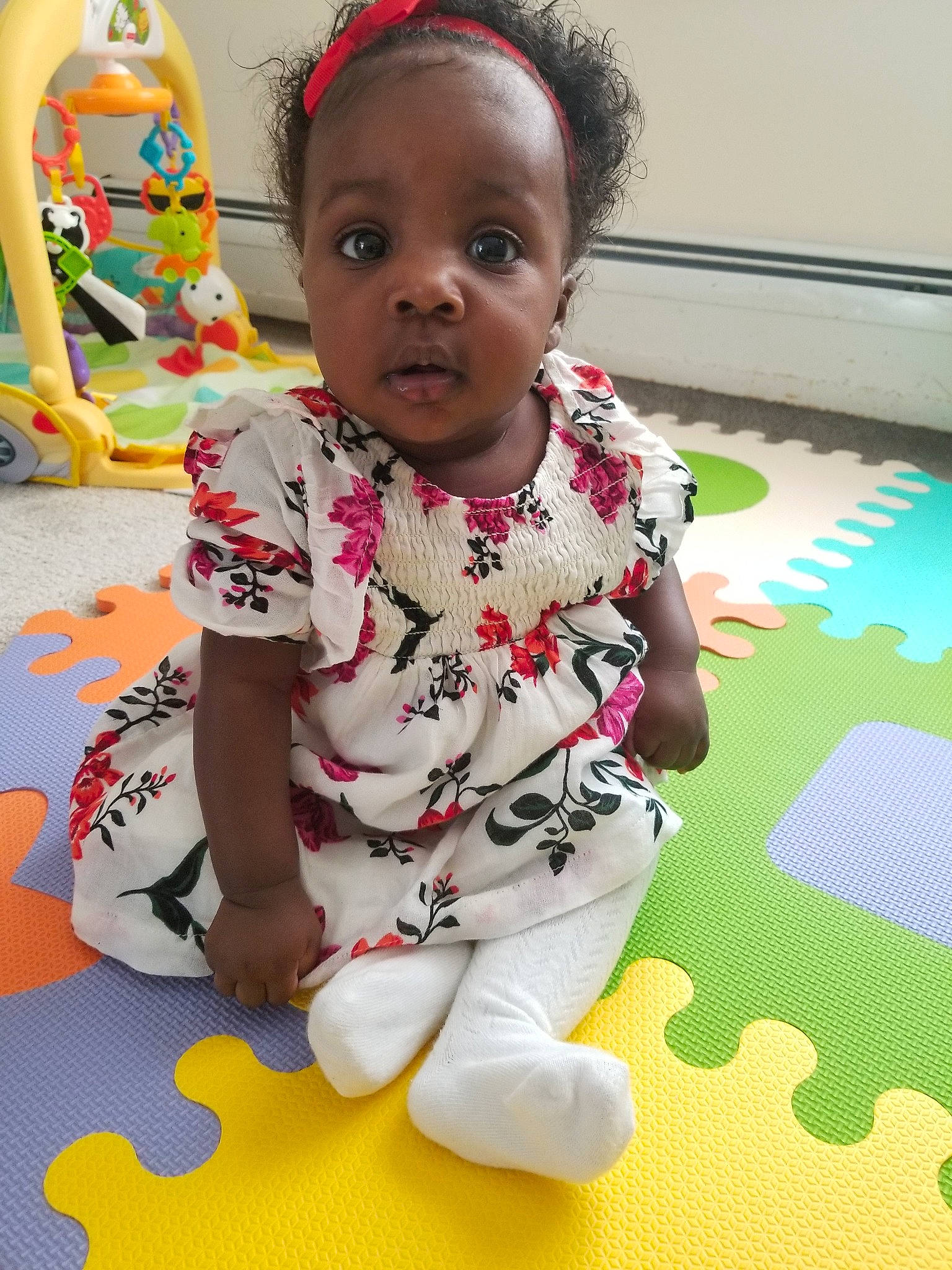 Denique is registered to the contest to win money with this photo: adaptation, baby, baby_toddler_clothing, cheek, child, floor, flooring, fun, head, person, play, room, sitting, skin, smile, t_shirt, toddler