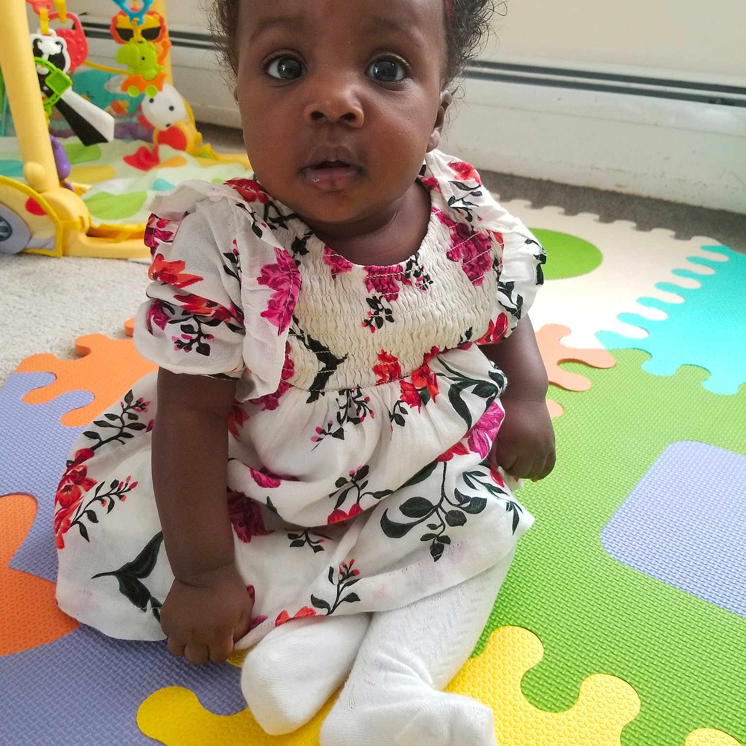 Denique is registered to the contest to win money with this photo: adaptation, baby, baby_toddler_clothing, cheek, child, floor, flooring, fun, head, person, play, room, sitting, skin, smile, t_shirt, toddler