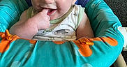 Harrison joined the competition — help win amazing prizes! baby, child, infant, smiling, sitting, baby_seat, colorful, finger_in_mouth, happy, indoor, carpet, clothing, toy, play, cute, person, young_child, home, comfort, seat
