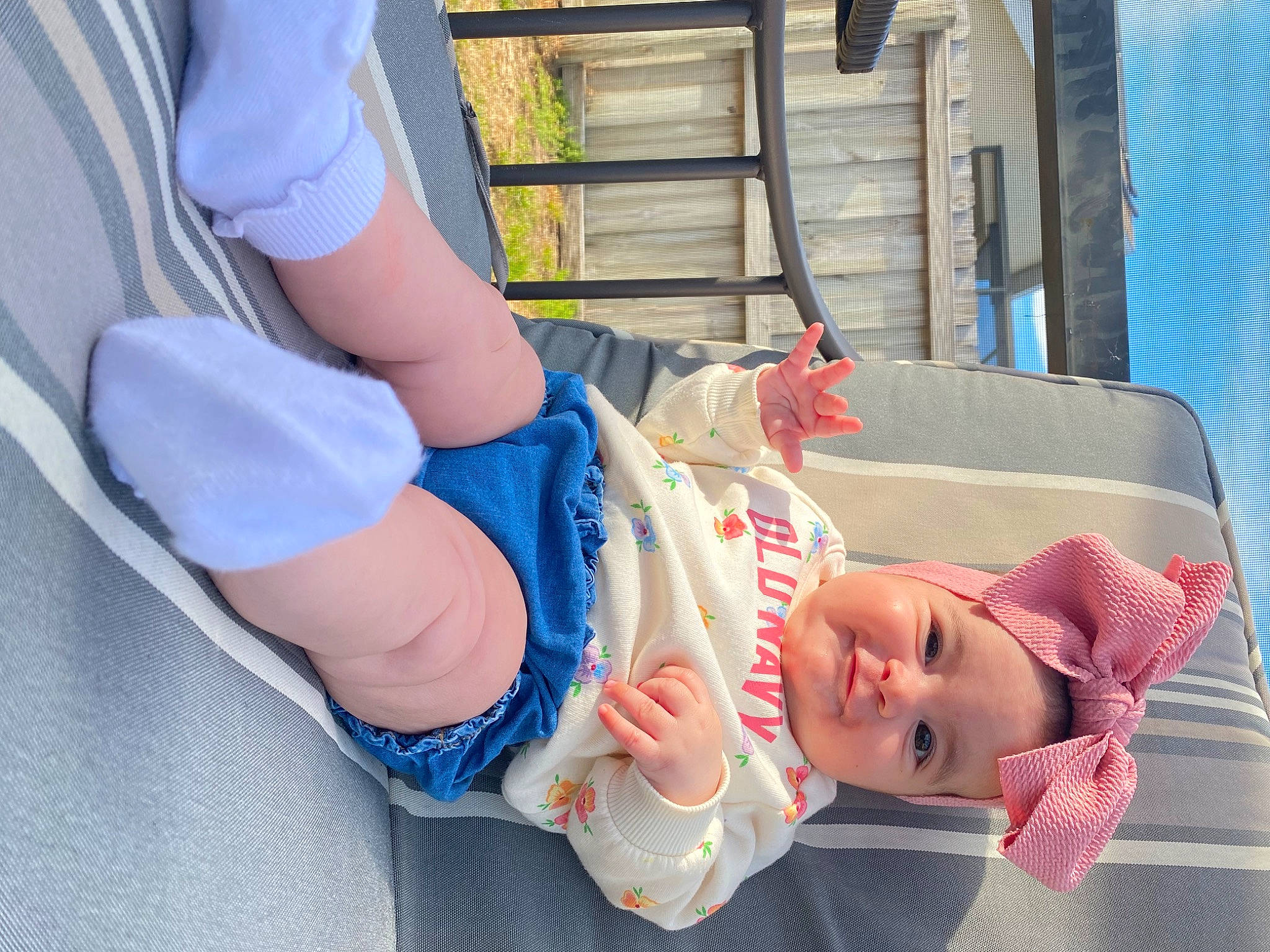 Haven is registered to the contest to win money with this photo: baby, baby_carriage, baby_products, baby_toddler_clothing, child, comfort, denim, electric_blue, foot, hat, human_leg, knee, leg, leisure, people, person, shorts, sitting, sock, thigh
