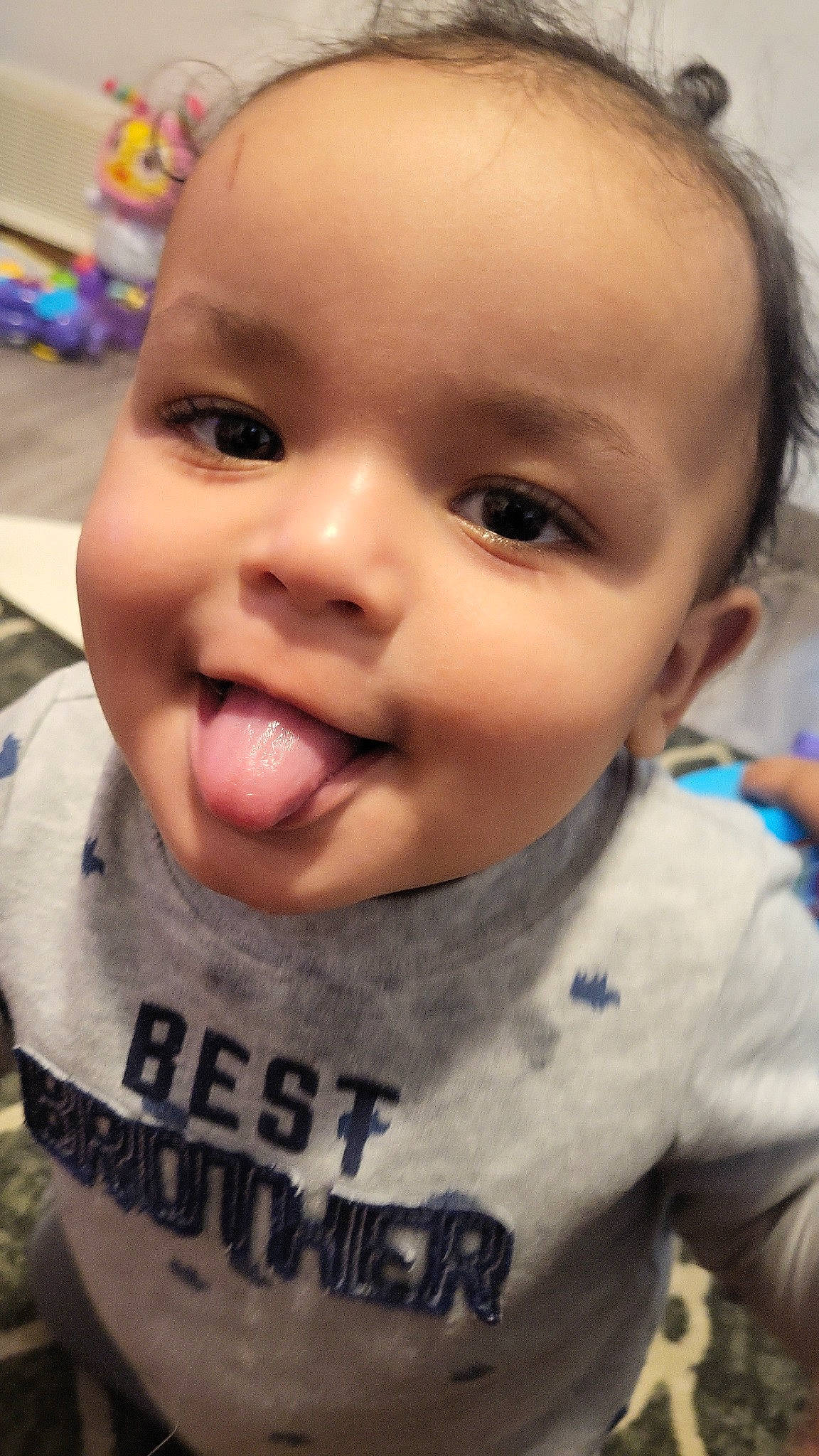 Koda is registered to the contest to win money with this photo: cheek, chin, ear, eyebrow, eyelash, forehead, fun, happy, iris, jaw, lip, mammal, mouth, neck, nose, person, skin, sleeve, smile, tongue