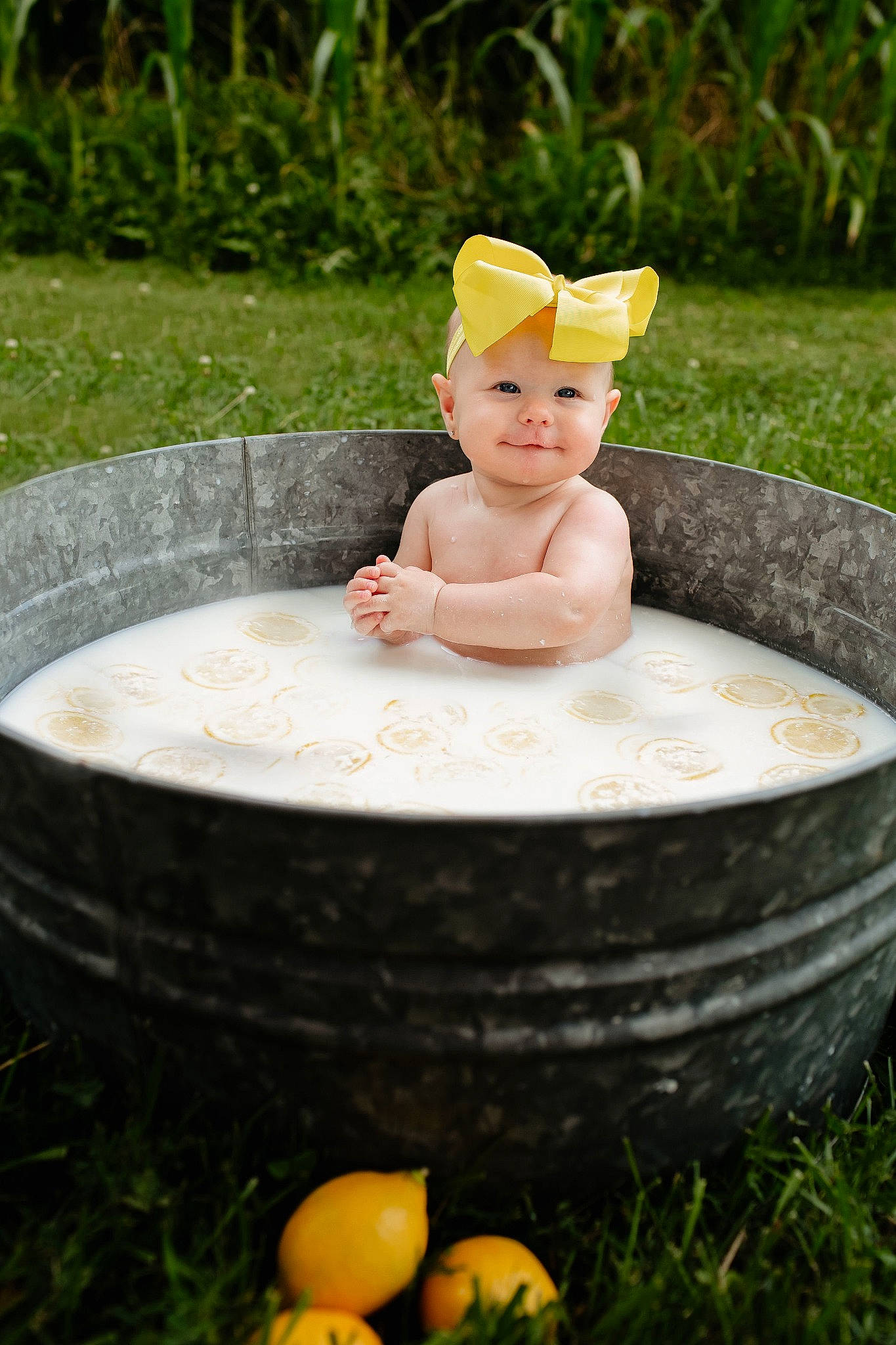 Avery is registered to the contest to win money with this photo: art, bathing, cheek, eye, fun, grass, green, hand, happy, headwear, human_body, joy, lawn, lawn_ornament, leisure, people_in_nature, person, plant, recreation, smile