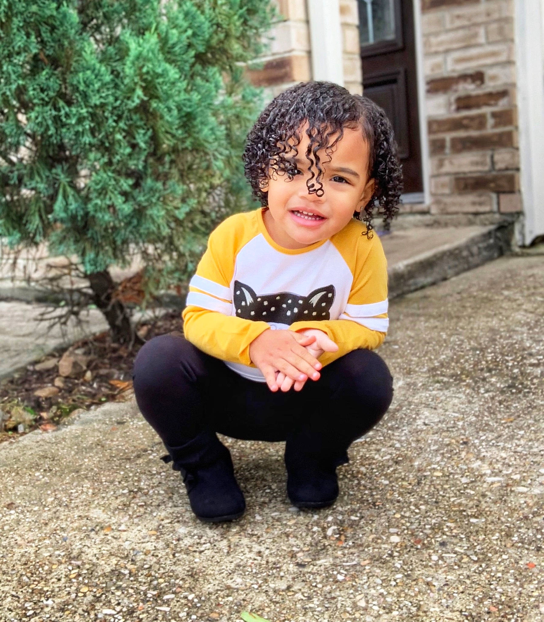 Aubriana is registered to the contest to win money with this photo: child, cool, face, facial_expression, grass, happy, head, leg, male, outerwear, people, person, photography, sitting, skin, smile, snapshot, toddler, tree, vacation