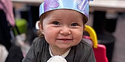 Lolah is registered to the contest to win money with this photo: toddler, child, smiling, crown, blanket, chair, indoor, happy, face, person, clothing, toy, seat, cute, baby, holding, portrait, infant, soft_toy, playful