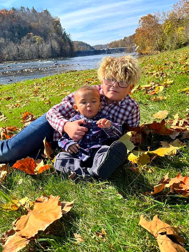 Easton joined the competition — help win amazing prizes! baby, botany, child, deciduous, fun, grass, happy, lake, landscape, leisure, luggage_and_bags, natural_landscape, people_in_nature, person, plant, sitting, sky, toddler, tree, water