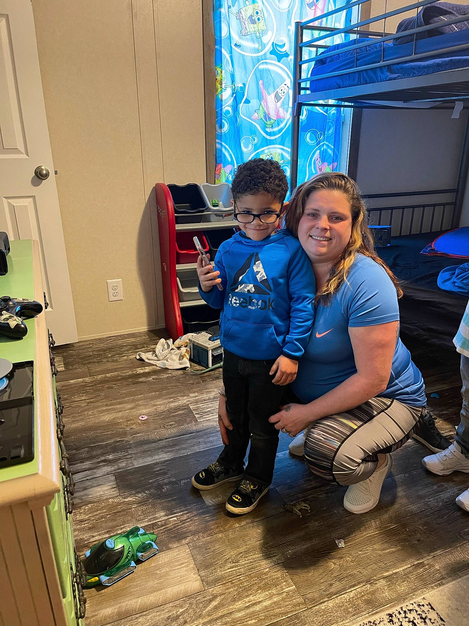 Zaedyn is registered to the contest to win money with this photo: blue, boot, child, cool, electric_blue, event, flooring, fun, happy, joy, leisure, luggage_and_bags, machine, person, recreation, room, smile, sneakers, standing, t_shirt