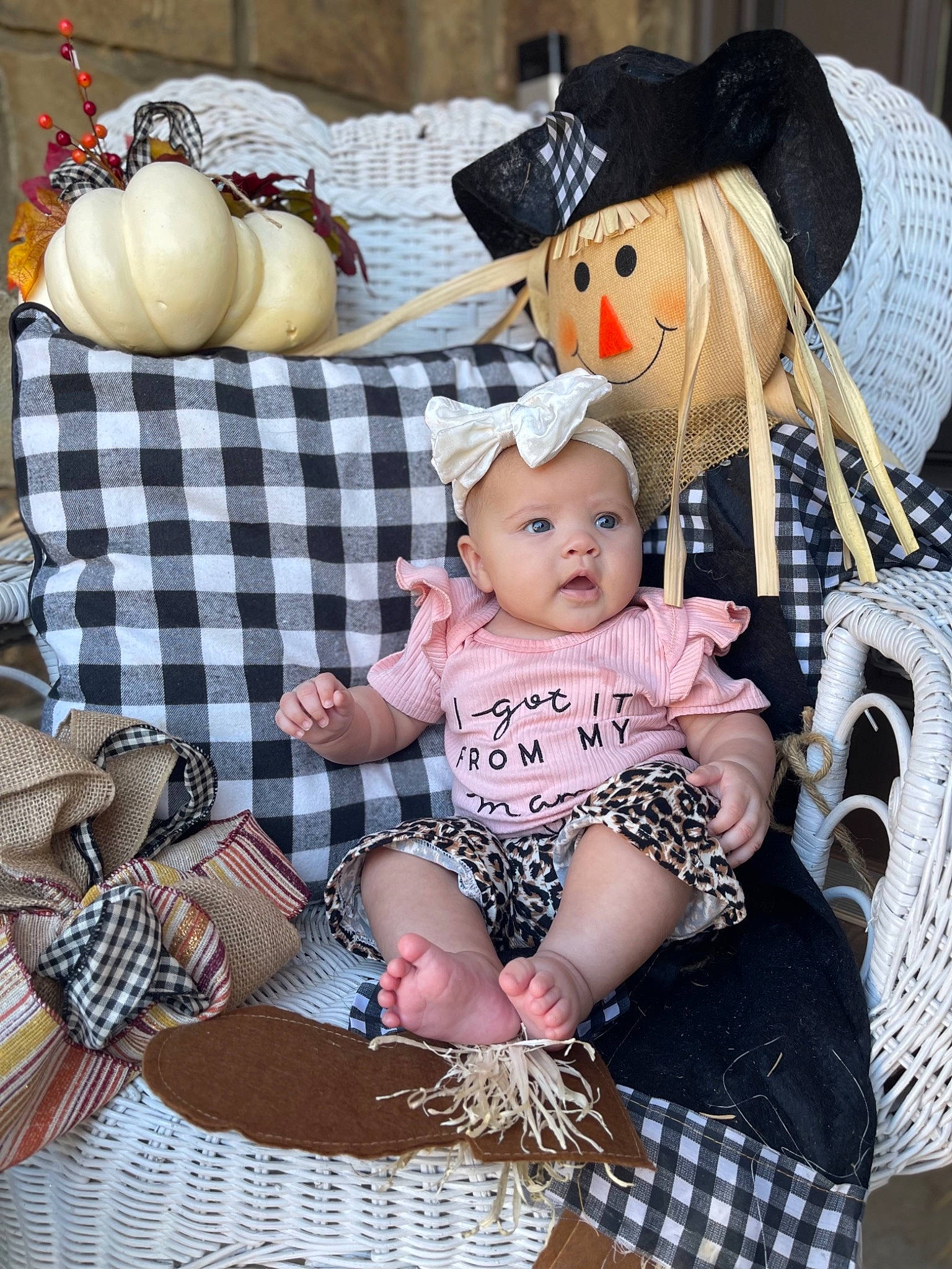 Regina is registered to the contest to win money with this photo: baby, baby_toddler_clothing, cap, chair, child, doll, event, fashion_accessory, hat, headwear, jewellery, lap, pattern, person, plaid, sitting, sock, sun_hat, tartan, textile
