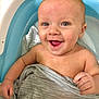 Levi is registered to the contest to win money with this photo: baby, smiling, bathtub, water, cloth, happy, child, infant, skin, face, hand, eyes, mouth, wet, bath, cute, young, person, fun, relaxation