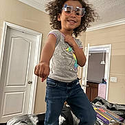 Aaliyah Thomas joined the competition — help win amazing prizes! accessories, bodypart, child, clothing, curlyhair, door, face, female, finger, girl, glasses, hair, happy, head, jeans, pants, person, photography, portrait, smile