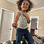 accessories, bodypart, child, clothing, curlyhair, door, face, female, finger, girl, glasses, hair, happy, head, jeans, pants, person, photography, portrait, smile