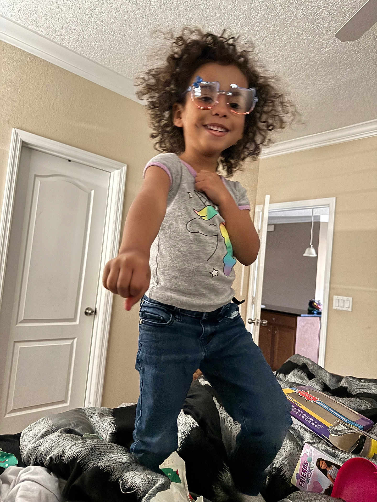 Aaliyah Thomas joined the competition — help win amazing prizes! accessories, bodypart, child, clothing, curlyhair, door, face, female, finger, girl, glasses, hair, happy, head, jeans, pants, person, photography, portrait, smile