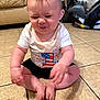 baby, child, sitting, floor, tiled_floor, white_shirt, black_shorts, expression, funny_face, indoor, living_room, car_seat, couch, person, cute, chubby, footwearless, hands, head, hair