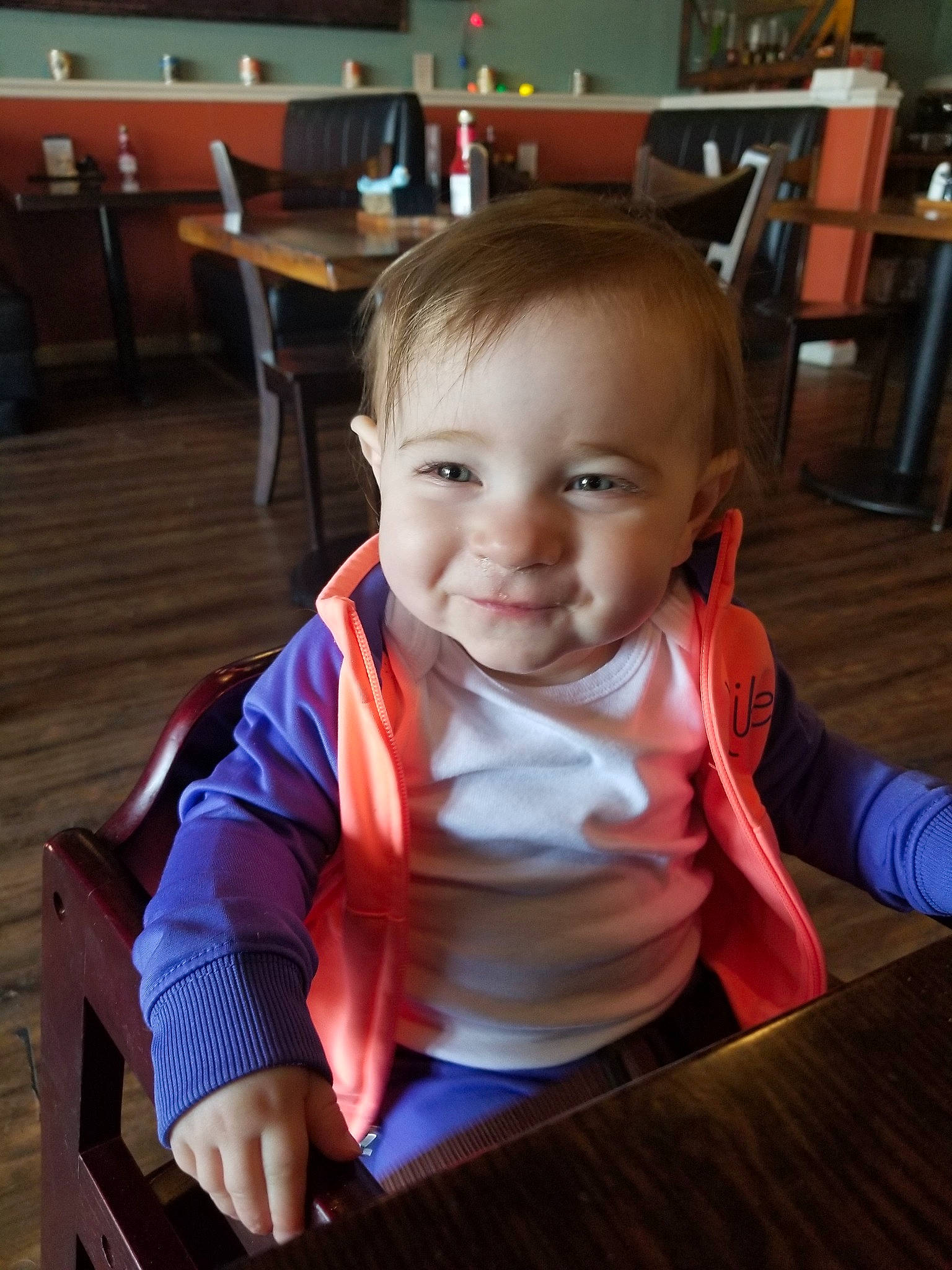 Erin joined the competition — help win amazing prizes! baby, cheek, child, eye, face, fun, head, person, play, room, sitting, skin, smile, table, toddler, wood