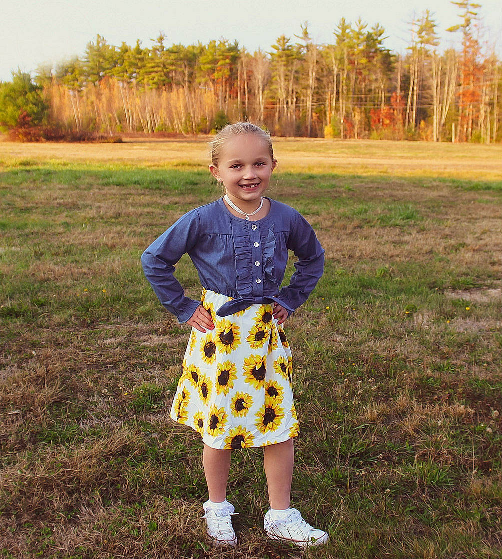 Lyllian joined the competition — help win amazing prizes! baby_toddler_clothing, grass, grass_family, grassland, happy, joy, lawn, leaf, meadow, pattern, people_in_nature, person, plaid, plant, recreation, sky, sleeve, smile, t_shirt, tartan