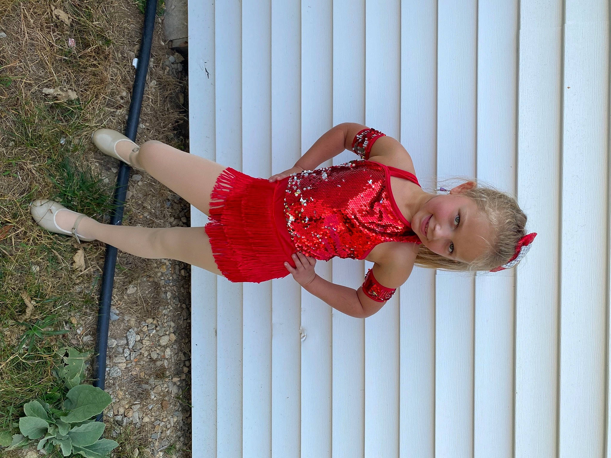 Lyllian is registered to the contest to win money with this photo: baby_toddler_clothing, child, dress, eye, face, hand, happy, human_body, human_leg, joy, pattern, people_in_nature, person, pink, plant, red, sleeve, smile, thigh, toddler