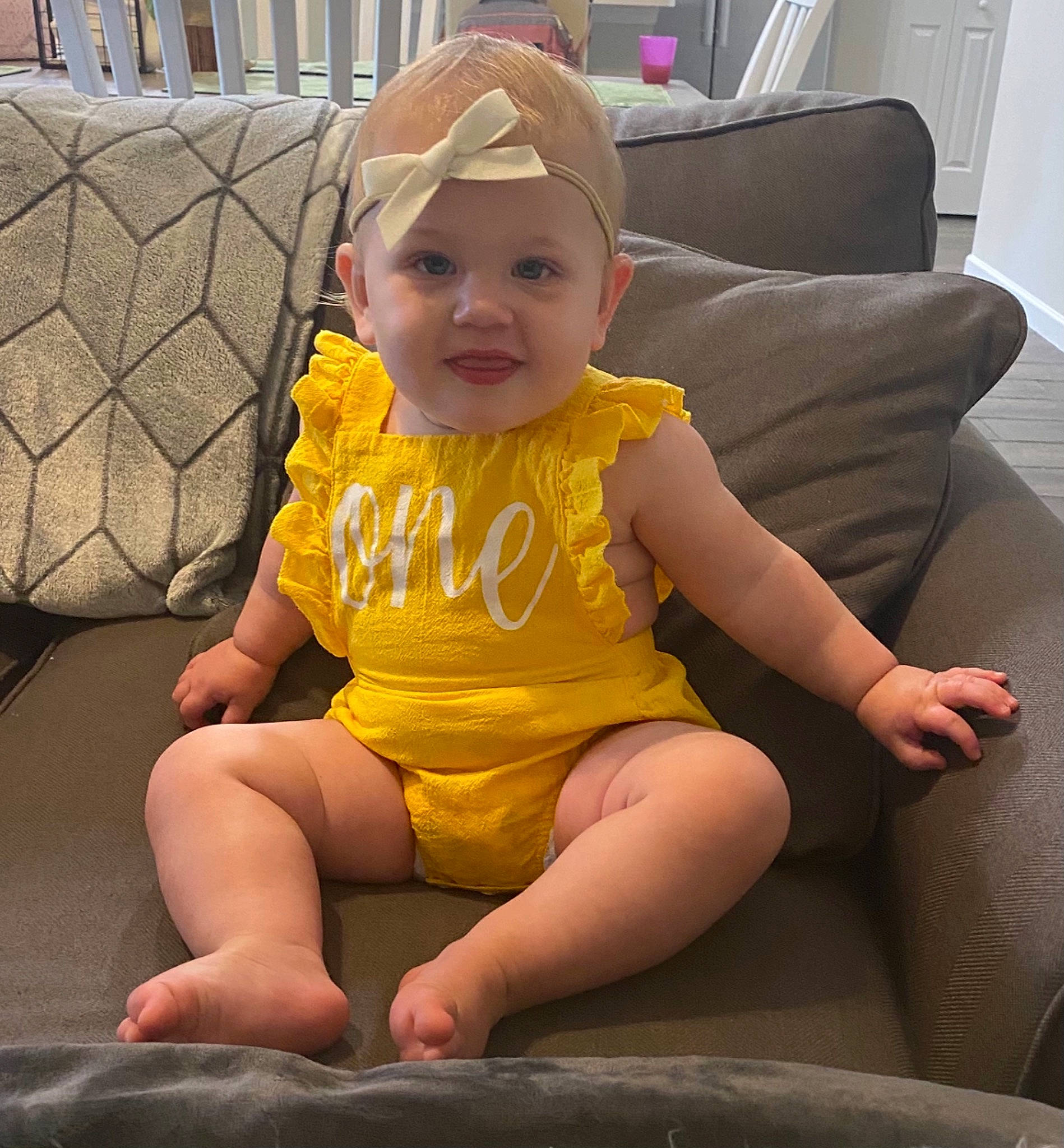 Berkley joined the competition — help win amazing prizes! baby, baby_toddler_clothing, cheek, child, clothing, comfort, couch, eye, face, fun, happy, headwear, knee, lap, leg, person, plant, skin, smile, thigh