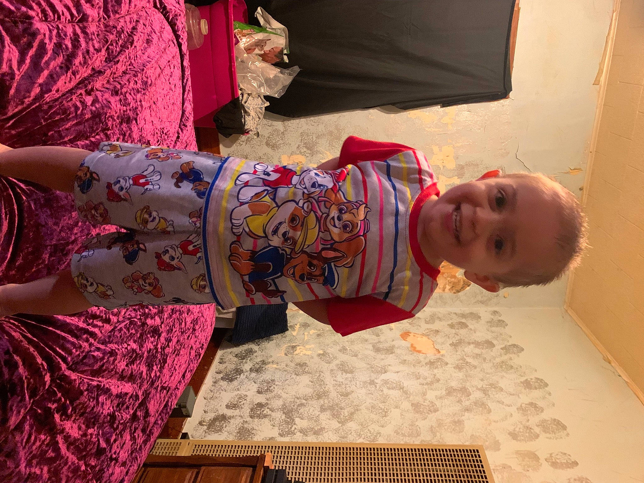 Hunter is registered to the contest to win money with this photo: baby, baby_toddler_clothing, child, day_dress, dress, event, fashion_design, flooring, fun, house, joy, magenta, pattern, peach, person, pink, room, skin, smile, toddler