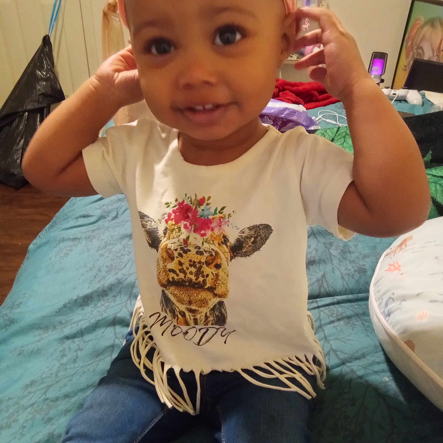 Christi'Onna is registered to the contest to win money with this photo: baby, bodypart, cap, clothing, couch, electronics, face, finger, furniture, hand, hat, head, jeans, mobilephone, pants, person, phone, photography, portrait, t_shirt