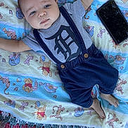 Noah joined the competition — help win amazing prizes! baby, infant, blanket, winnie_the_pooh, clothing, suspenders, pants, face, lying_down, phone, footwear, cute, child, blue, gray, pattern, toy_character, soft_texture, portrait, indoor