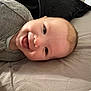 Ivan joined the competition — help win amazing prizes! baby, smiling, tongue_out, face, infant, clothing, bed, pillow, lying_down, happy, cute, skin, head, eyes, mouth, cheeks, person, indoors, cozy, sleepwear