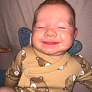 Ivan joined the competition — help win amazing prizes! baby, smiling, onesie, teddy_bear_pattern, infant, face, closed_eyes, cute, skin, hand, finger, laying, soft_surface, child, person, sleepy, happy, clothing, cute_baby, young_child