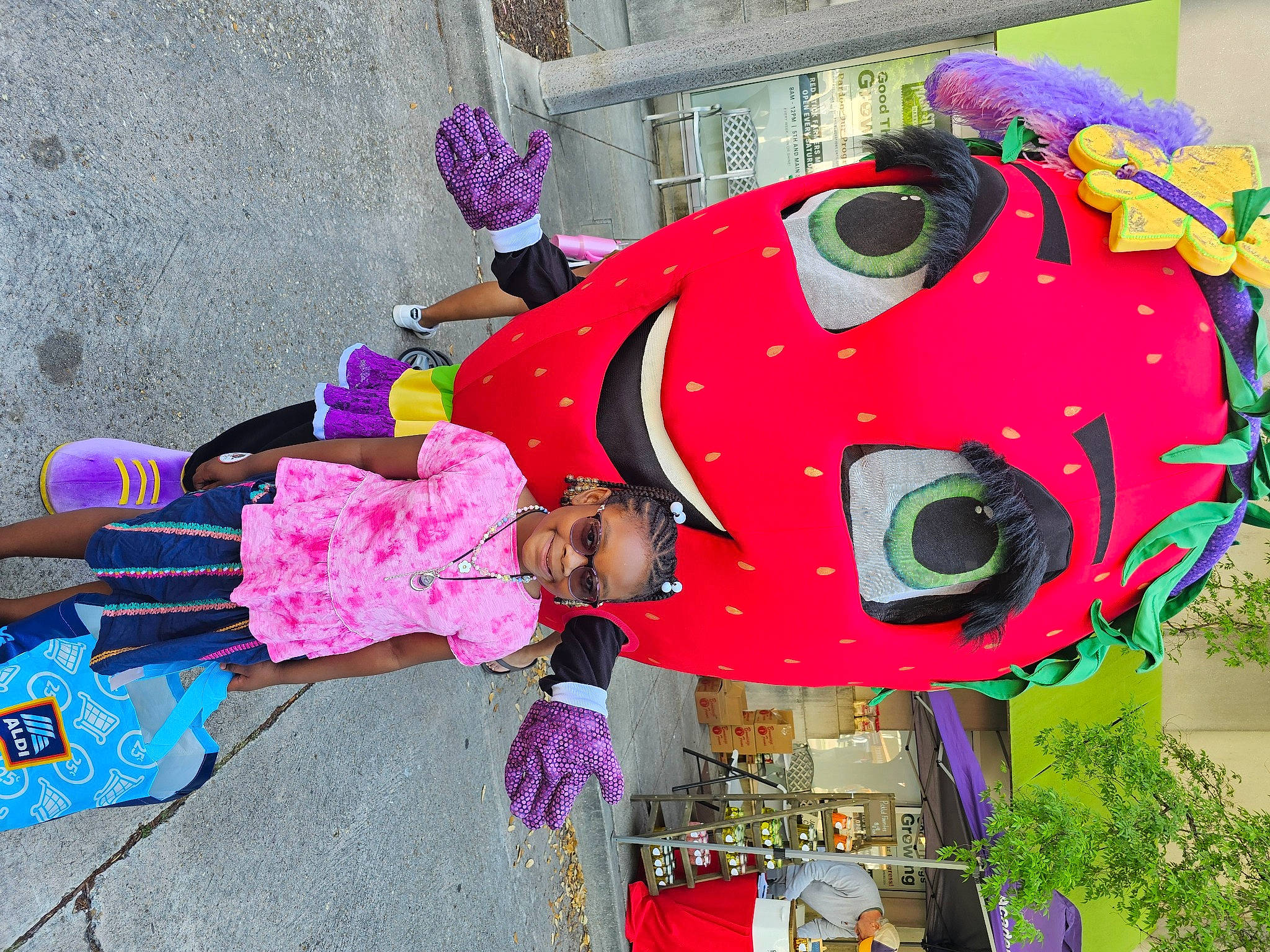 Noni joined the competition — help win amazing prizes! carmine, costume, event, festival, fun, joy, leisure, magenta, party_supply, person, pink, plant, plush, recreation, stuffed_toy, toddler, toy, tree, vehicle