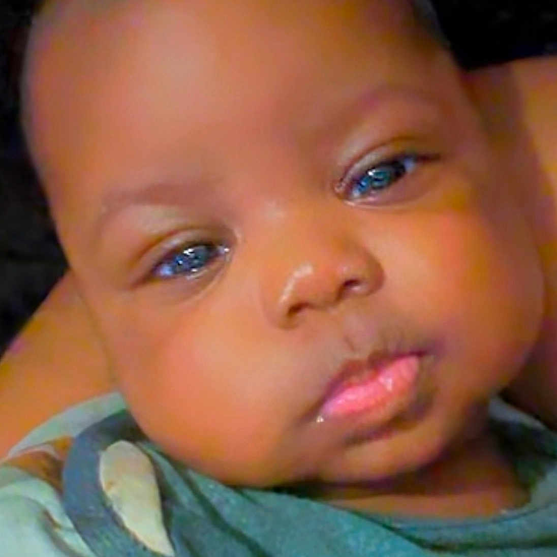 Zyheir is registered to the contest to win money with this photo: baby, child, face, eyes, chubby_cheeks, clothing, portrait, infant, cute, close_up, young_child, person, skin, head, expression, looking, indoors, soft_light, casual, toddler