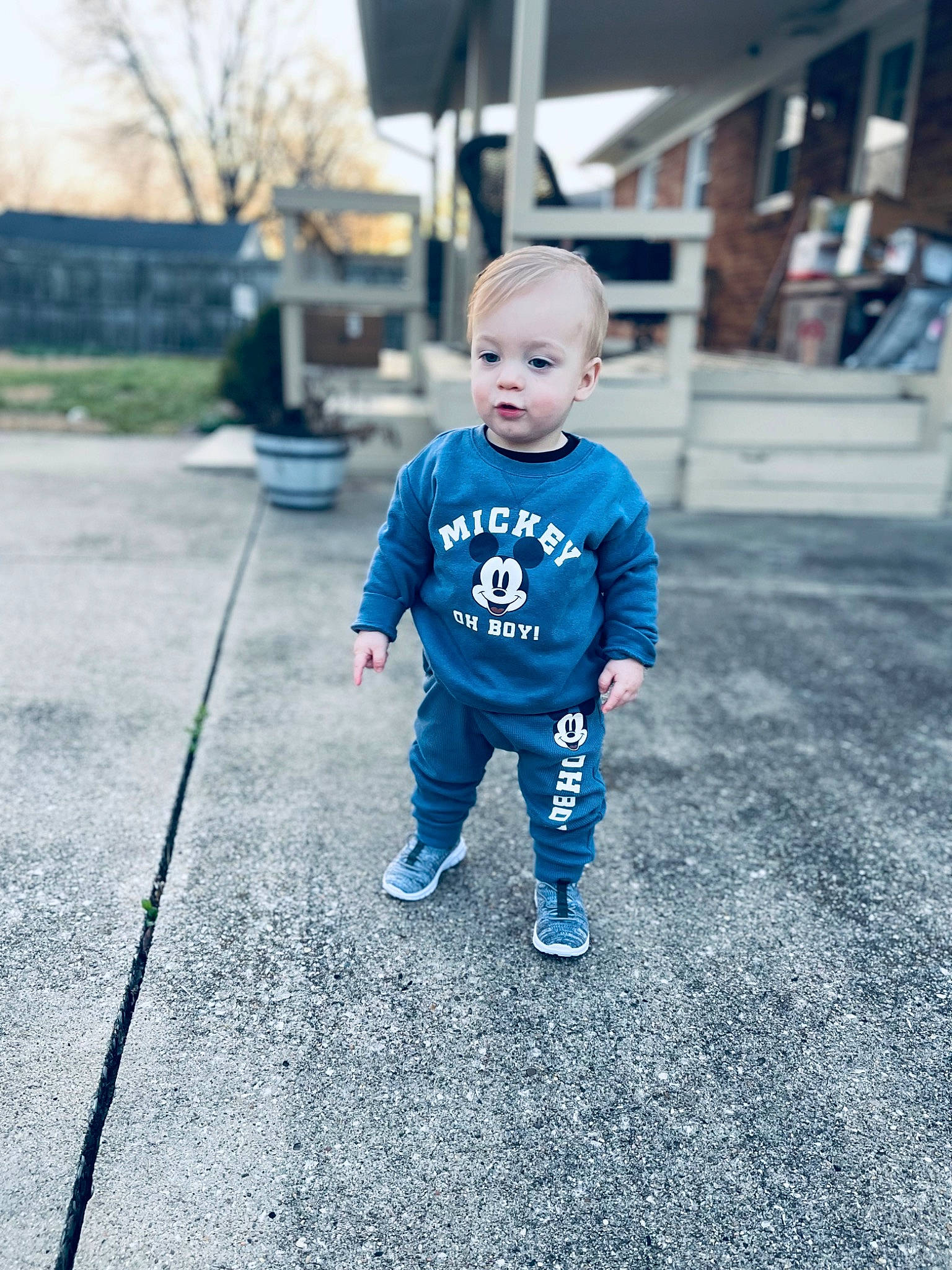 Luke is registered to the contest to win money with this photo: asphalt, baby, baby_toddler_clothing, child, city, electric_blue, fun, grass, grey, happy, person, plant, recreation, road_surface, sidewalk, sky, sleeve, standing, t_shirt, toddler