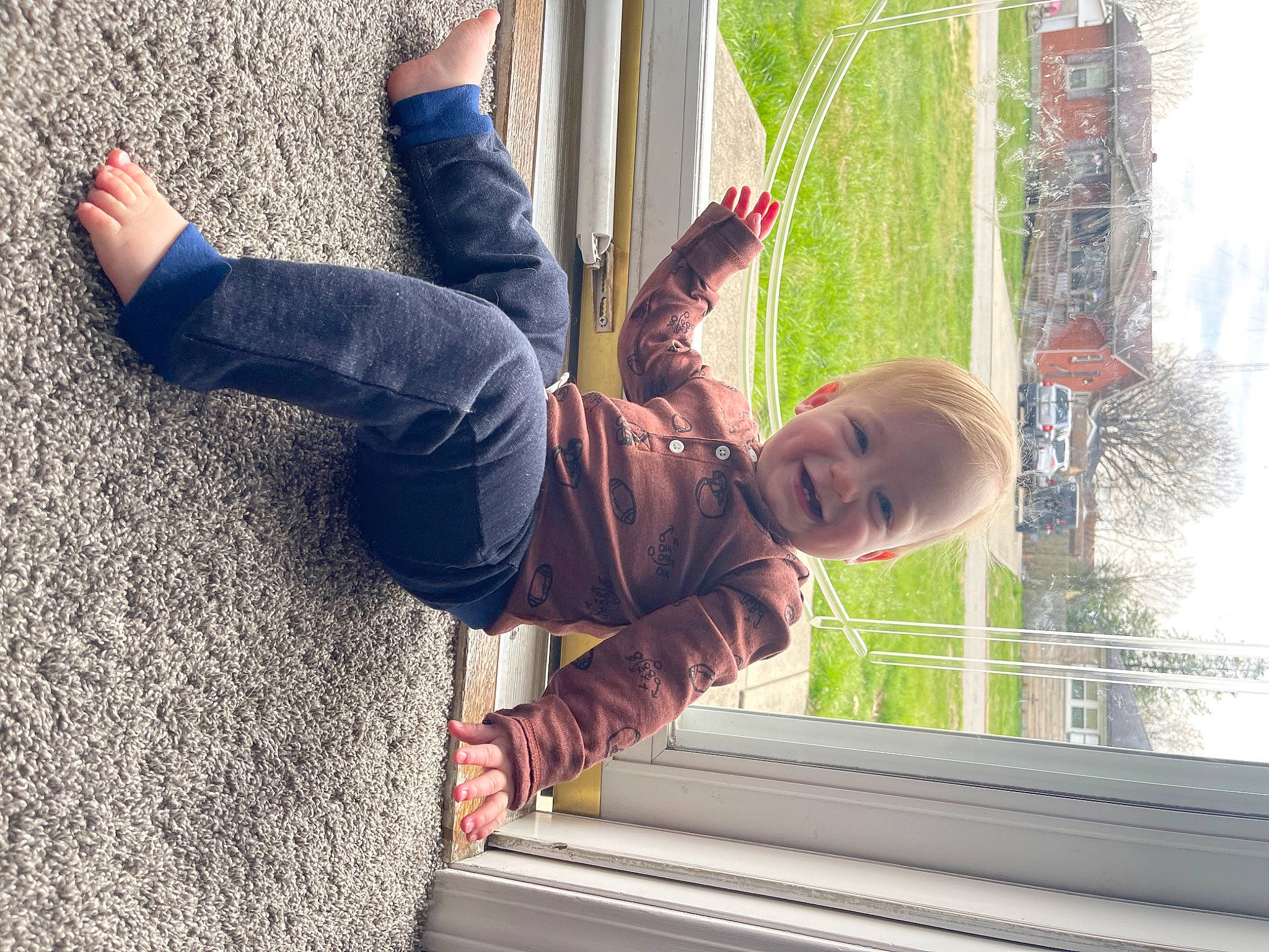 Luke is registered to the contest to win money with this photo: child, denim, fun, gesture, grass, happy, human_leg, joy, leisure, people_in_nature, person, plant, recreation, smile, toddler, tree, vacation, walking_shoe