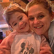 Amelia joined the competition — help win amazing prizes! adult, casual, child, closeup, cozy, face, family, fun, happy, hoodie, indoor, lighting, minnie_mouse, person, pink, portrait, smile, together, warm, wooden_ceiling