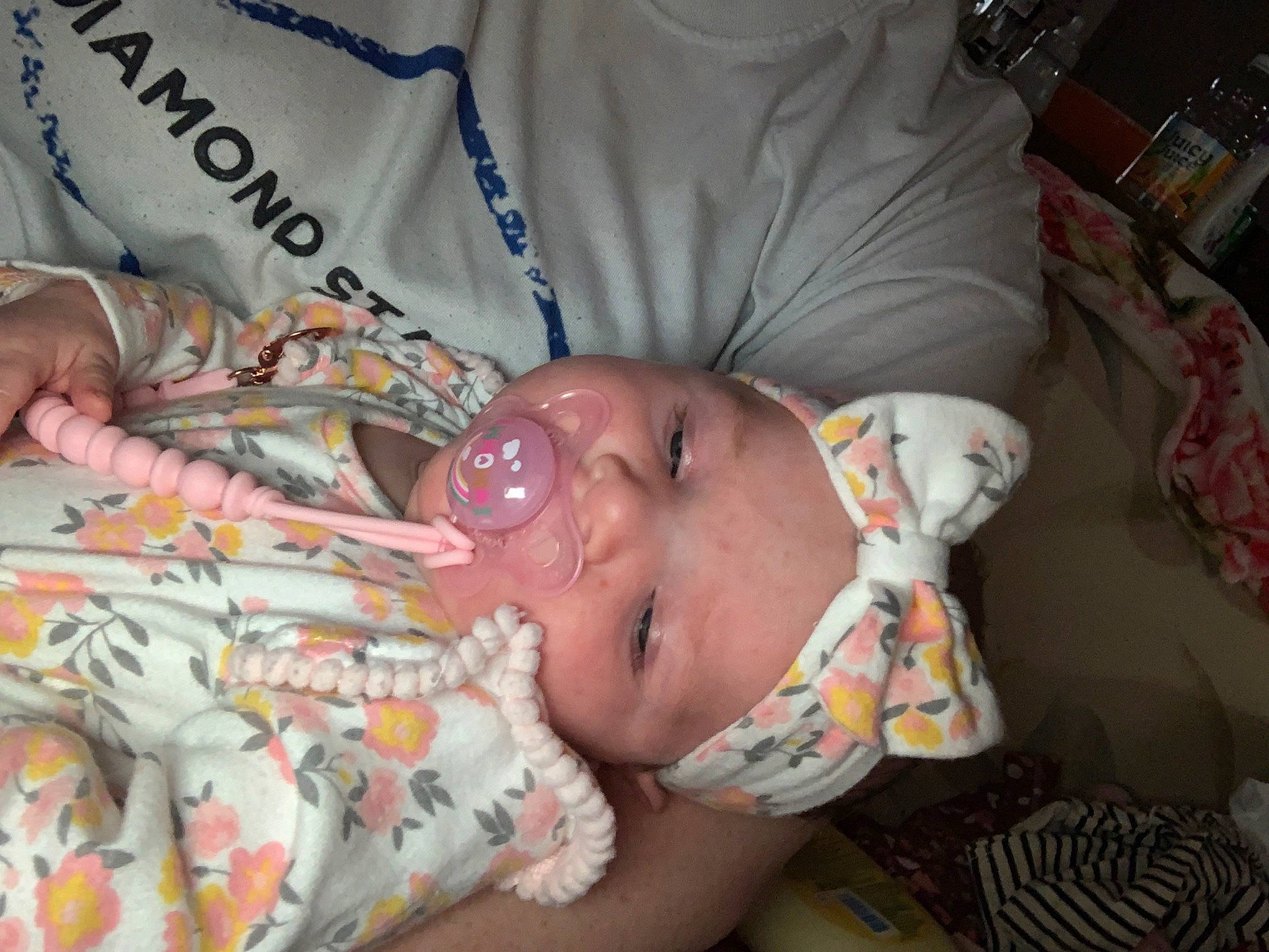 Oaklynn is registered to the contest to win money with this photo: abdomen, baby, baby_products, bedtime, cheek, child, childbirth, comfort, event, happy, headwear, hospital, linens, mouth, nap, nose, person, room, sleep, smile