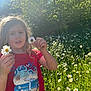child, daisies, flower, meadow, sunlight, red_shirt, nature, greenery, outdoor, grass, summer, happy, person, plant, field, casual_clothing, daytime, portrait, flora, holding