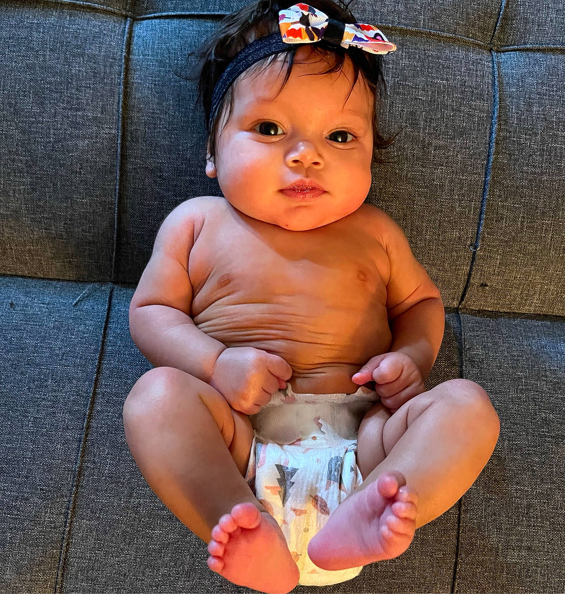 Anaya is registered to the contest to win money with this photo: arm, baby, baby_toddler_clothing, barefoot, finger, flash_photography, foot, gesture, hand, happy, headwear, human_leg, knee, lip, mouth, nail, person, skin, stomach, thigh