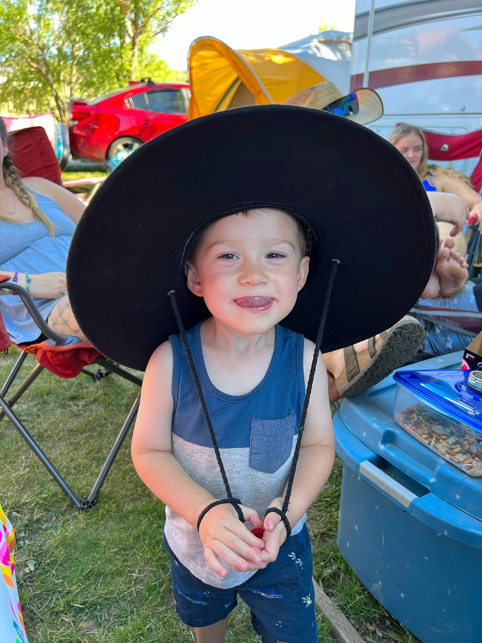 Hunter joined the competition — help win amazing prizes! auto_part, automotive_exterior, blue, bumper, chair, electric_blue, event, fun, grass, happy, hat, headgear, headwear, joy, leisure, motor_vehicle, person, recreation, shorts, smile