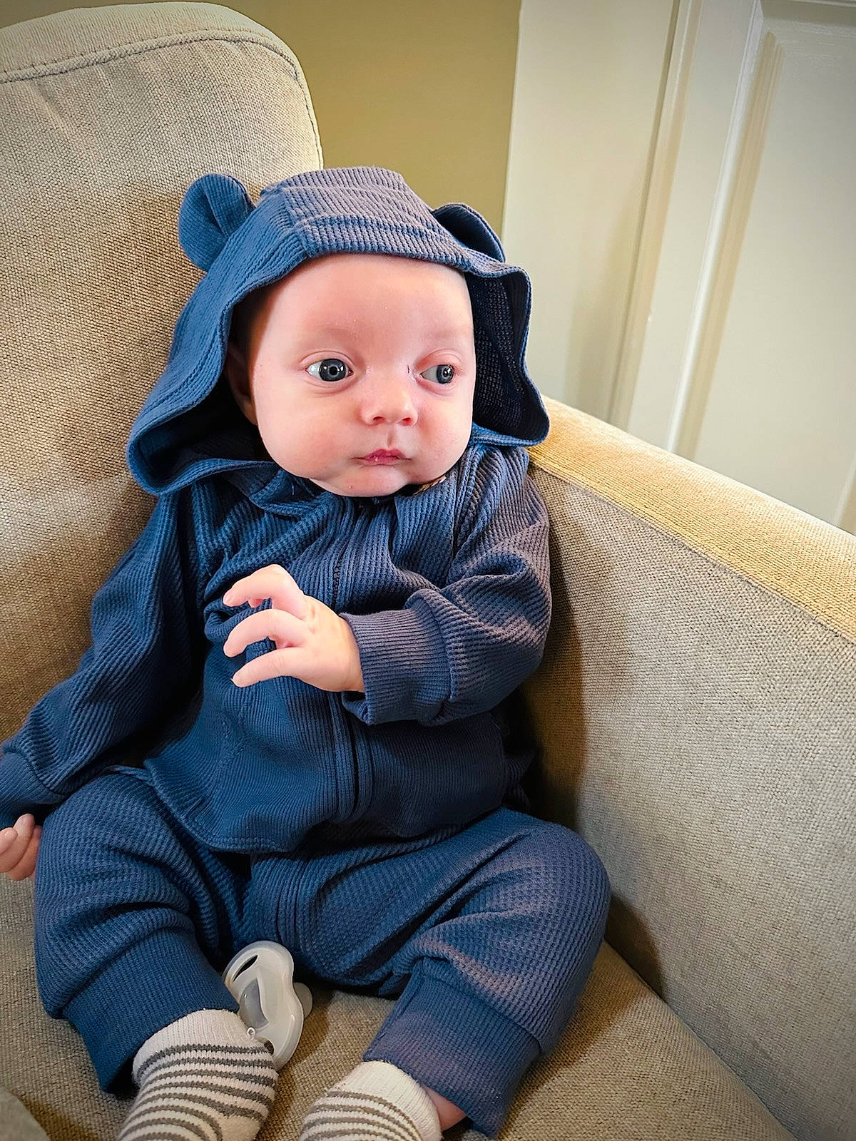 Ziggy is registered to the contest to win money with this photo: baby, baby_toddler_clothing, cap, cheek, clothing, comfort, eye, face, facial_expression, hairstyle, headwear, iris, lip, outerwear, person, product, skin, sleeve, standing, sun_hat