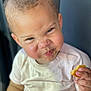 toddler, child, face, expression, food, cake, crumbs, hand, white_shirt, messy, portrait, indoor, cheek, skin, eyes, curly_hair, cute, snack, emotion, person