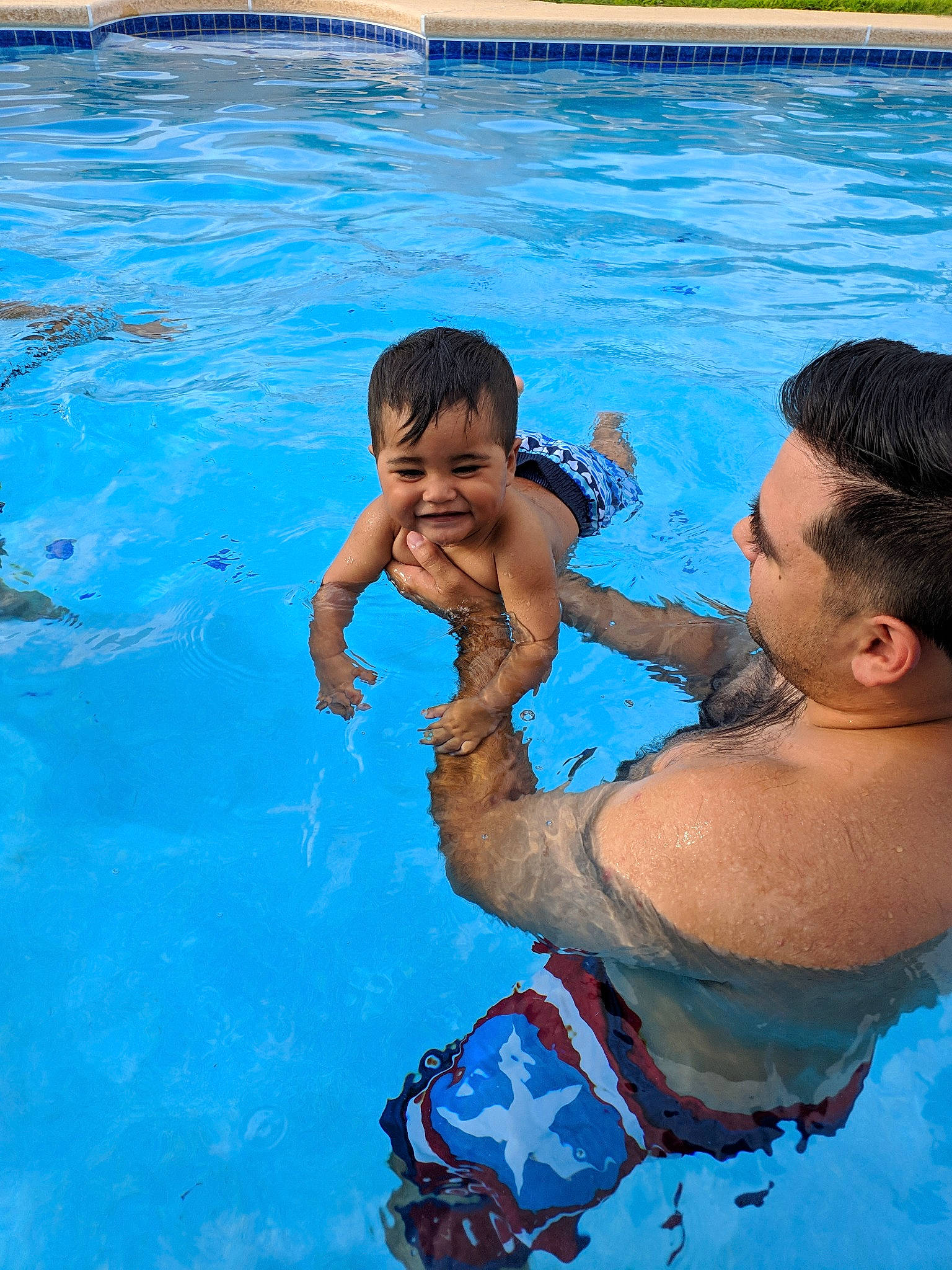 Liam is registered to the contest to win money with this photo: child, father, fun, games, happy, joy, leisure, male, muscle, person, play, recreation, smile, summer, swimming, swimming_pool, toddler, vacation, water