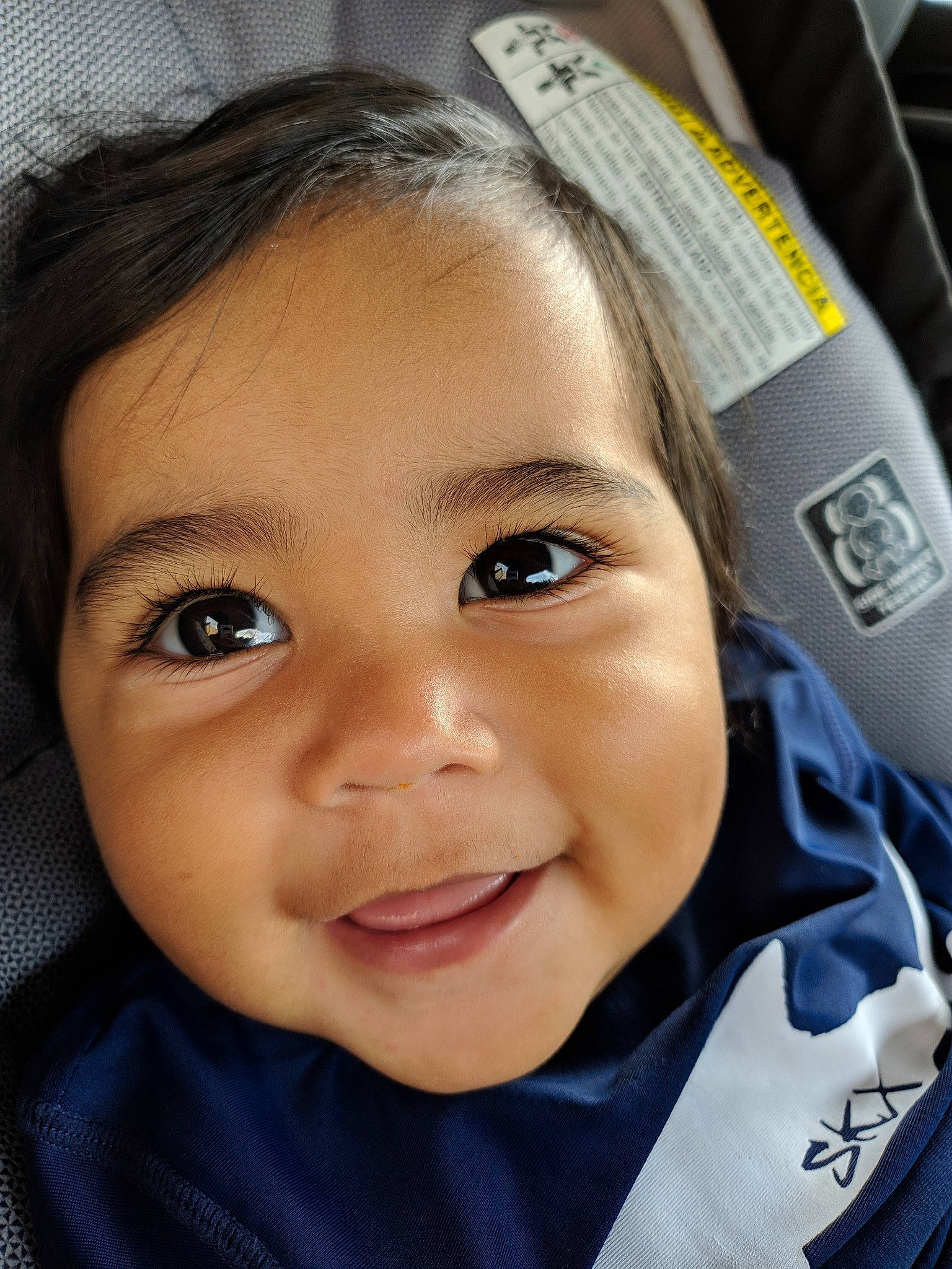 Liam is registered to the contest to win money with this photo: baby, cheek, child, chin, close_up, eye, eyebrow, face, facial_expression, forehead, hair, head, iris, joy, lip, mouth, nose, organ, person, skin