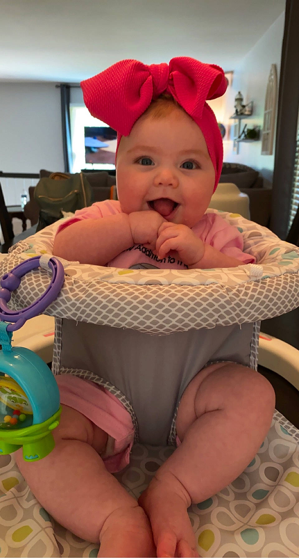 Brynley joined the competition — help win amazing prizes! baby, baby_laughing, baby_products, baby_toddler_clothing, chair, cheek, child, comfort, fun, happy, hat, headwear, human_body, lap, mouth, person, pink, skin, smile, thigh