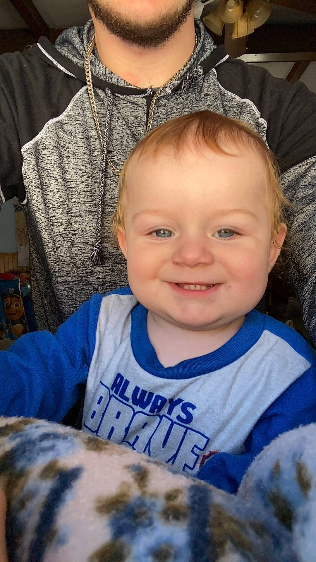 Peter Jr is registered to the contest to win money with this photo: black, cheek, chin, eye, eyebrow, forehead, gesture, happy, head, iris, joy, mammal, organ, outerwear, person, skin, sleeve, smile, t_shirt, textile