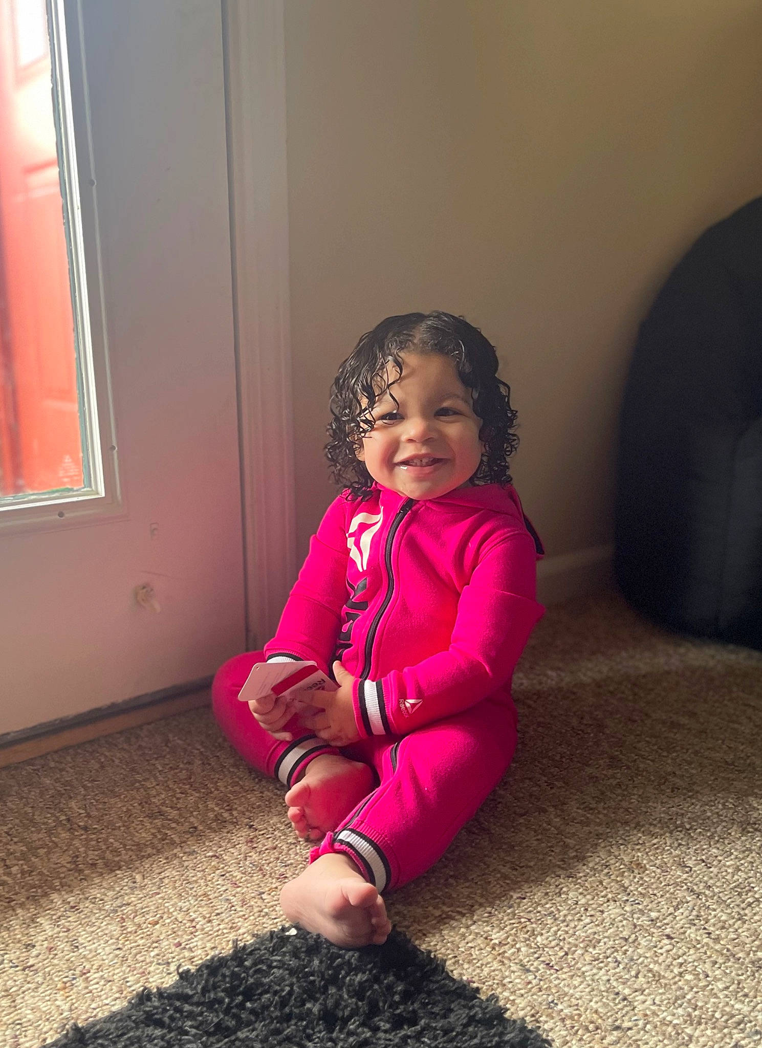 Aleina joined the competition — help win amazing prizes! baby_toddler_clothing, comfort, floor, flooring, fun, happy, hardwood, human_leg, joy, knee, magenta, person, pink, purple, sleeve, smile, standing, tints_and_shades, toddler, wall